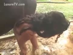 A brunette woman got into a mudslide with a horse.